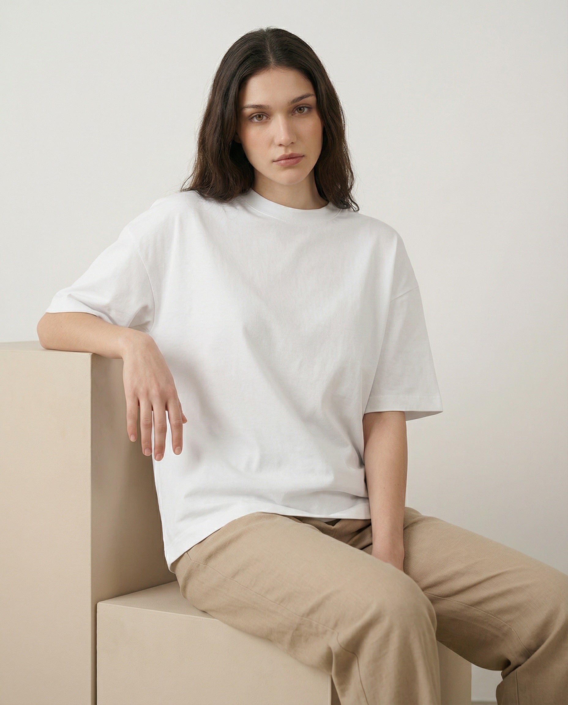 Aurulu women's oversized print tee made from soft material, featuring a relaxed fit and stylish design on a light-colored fabric.