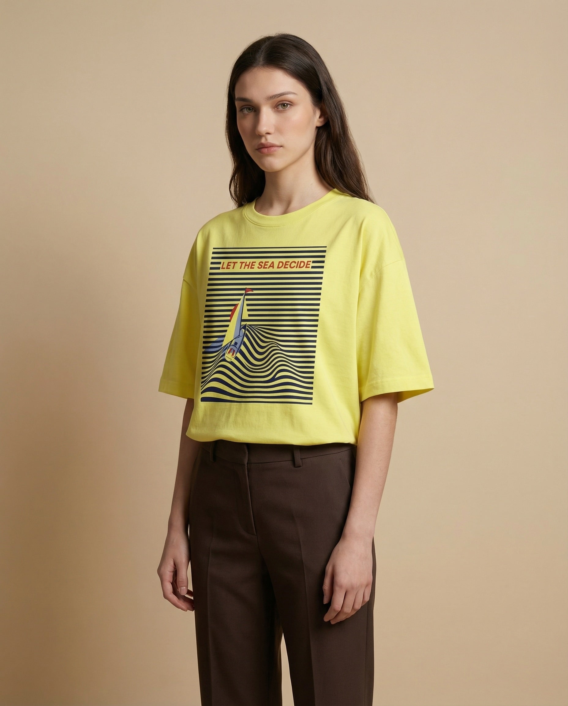 Women’s oversized tee by Aurulu with sea-themed print, made from soft material, featuring ocean-inspired design on relaxed-fit shirt.