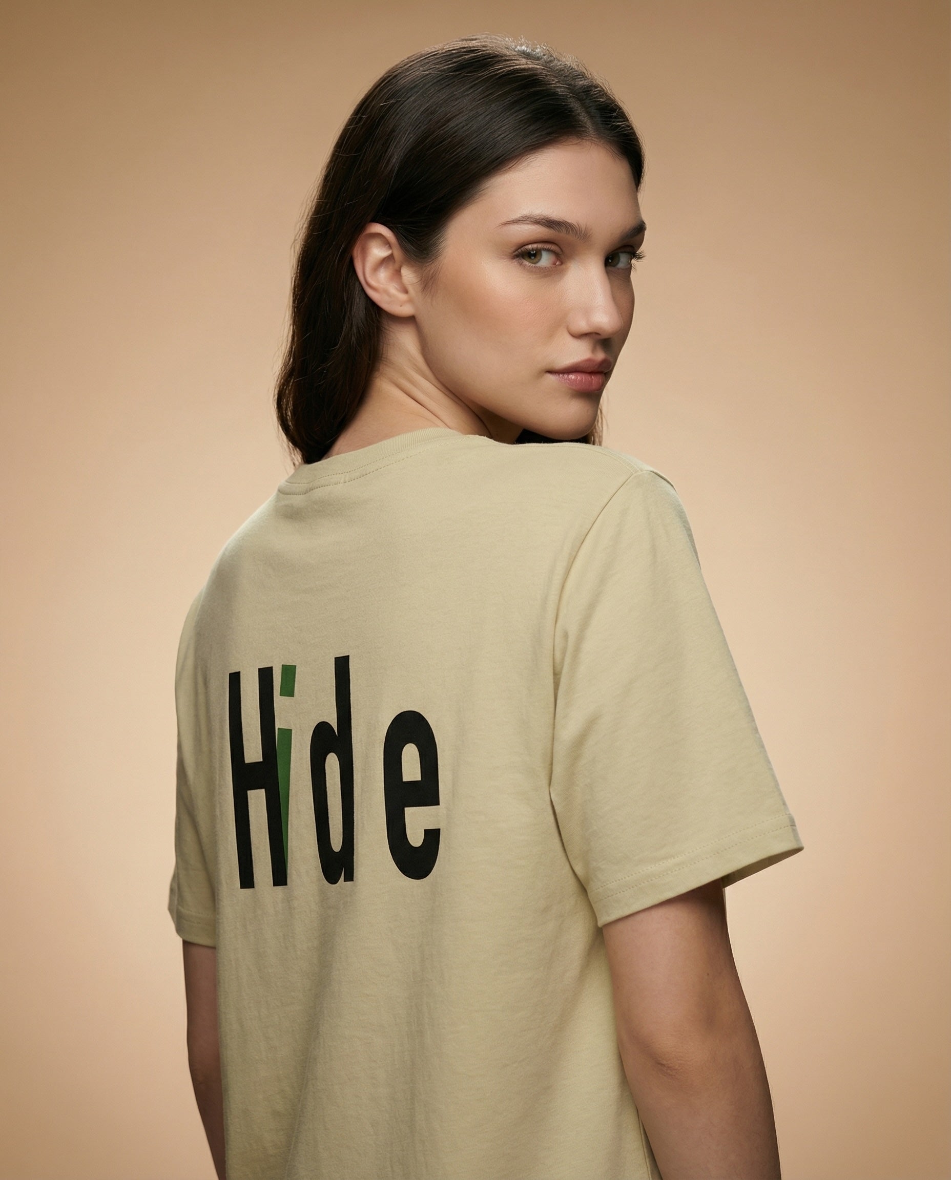 Pink "Hidden Identity" women's print tee by aurulu, showcasing a casual fit and graphic design on soft fabric.
