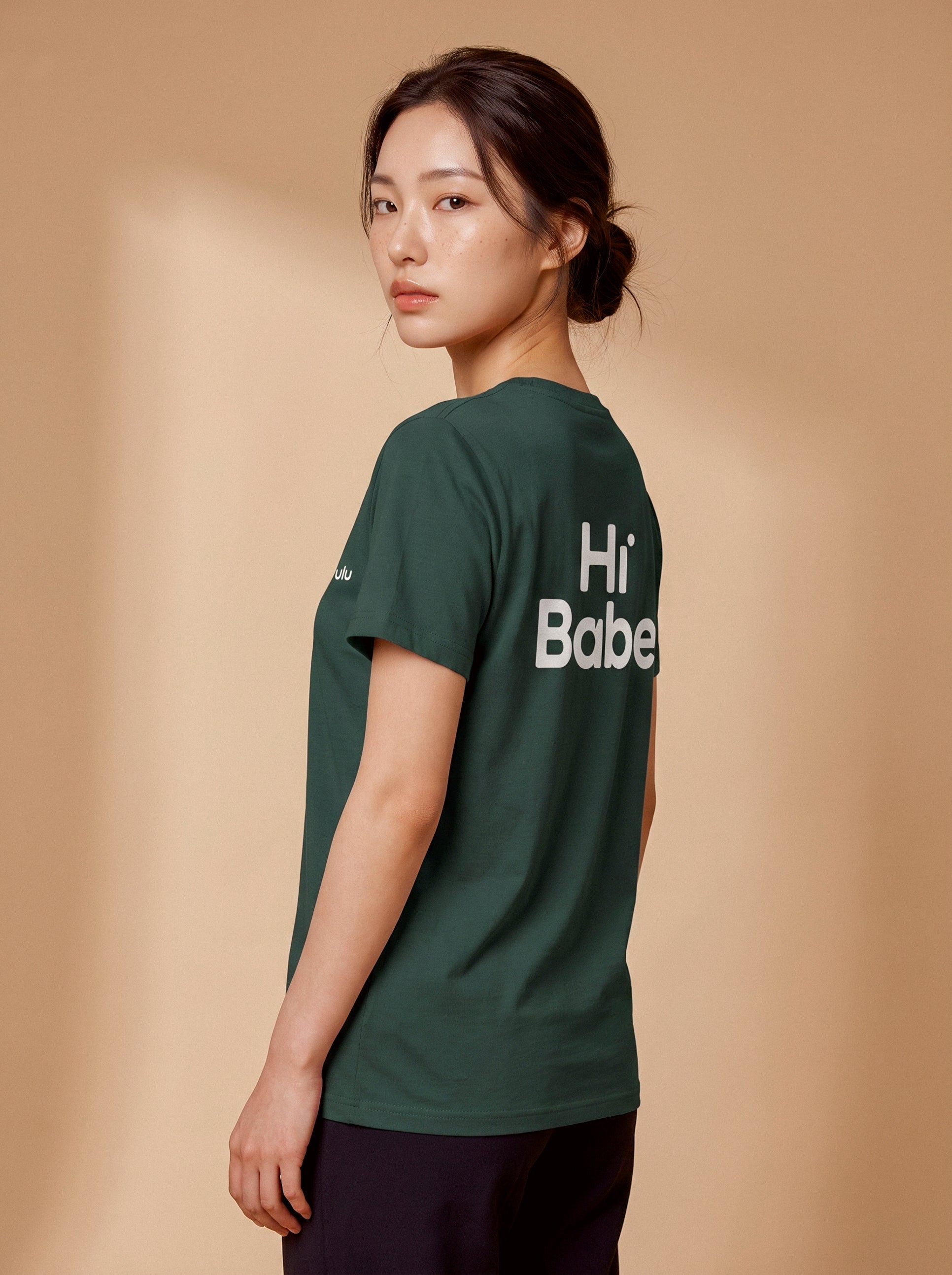 Hi Babe organic cotton T-shirt by aurulu with colorful print on soft, sustainable fabric, shown laid flat.