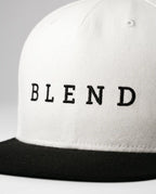 Aurulu Blend Snapback Cap with printed fabric design, featuring a structured black and white print material for casual style