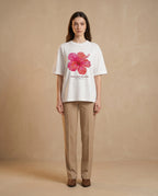 Aurulu Bloom With Intention women's oversized print tee featuring a floral design on soft fabric.