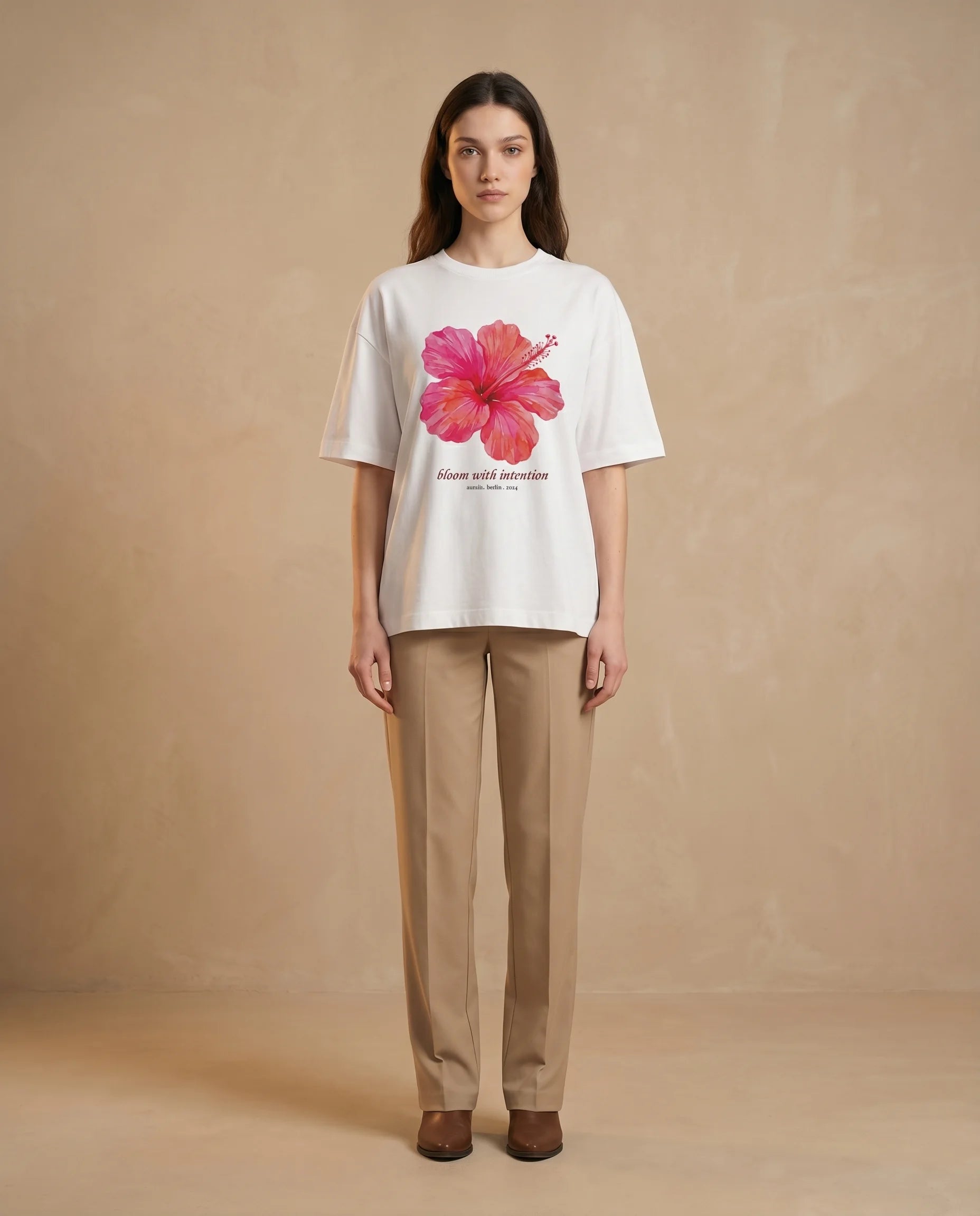 Aurulu Bloom With Intention women's oversized print tee featuring a floral design on soft fabric.