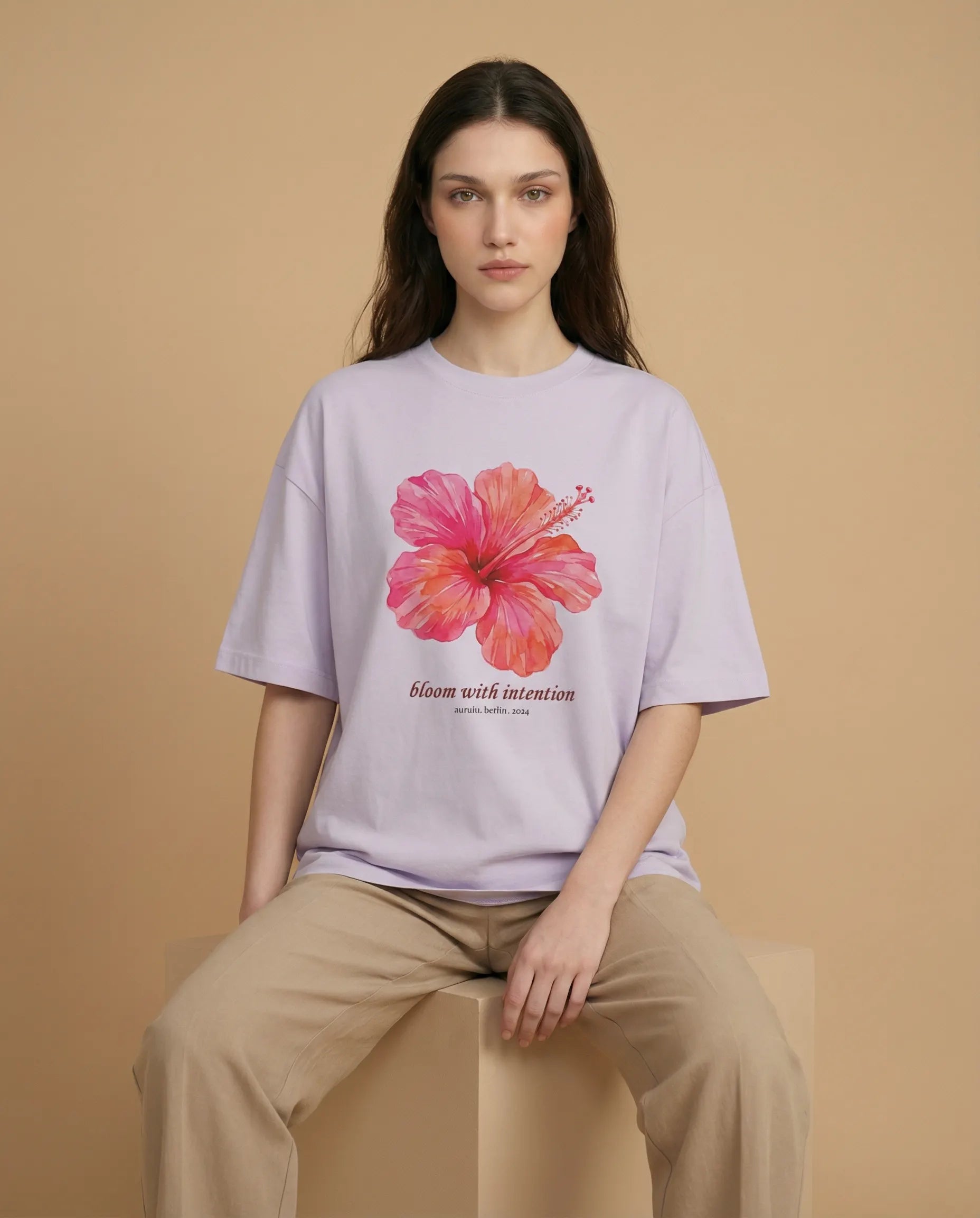 Aurulu Bloom With Intention women's oversized print tee featuring a floral design on soft fabric.