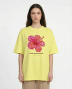 Aurulu Bloom With Intention women's oversized print tee featuring a vibrant, artistic floral design on soft fabric.