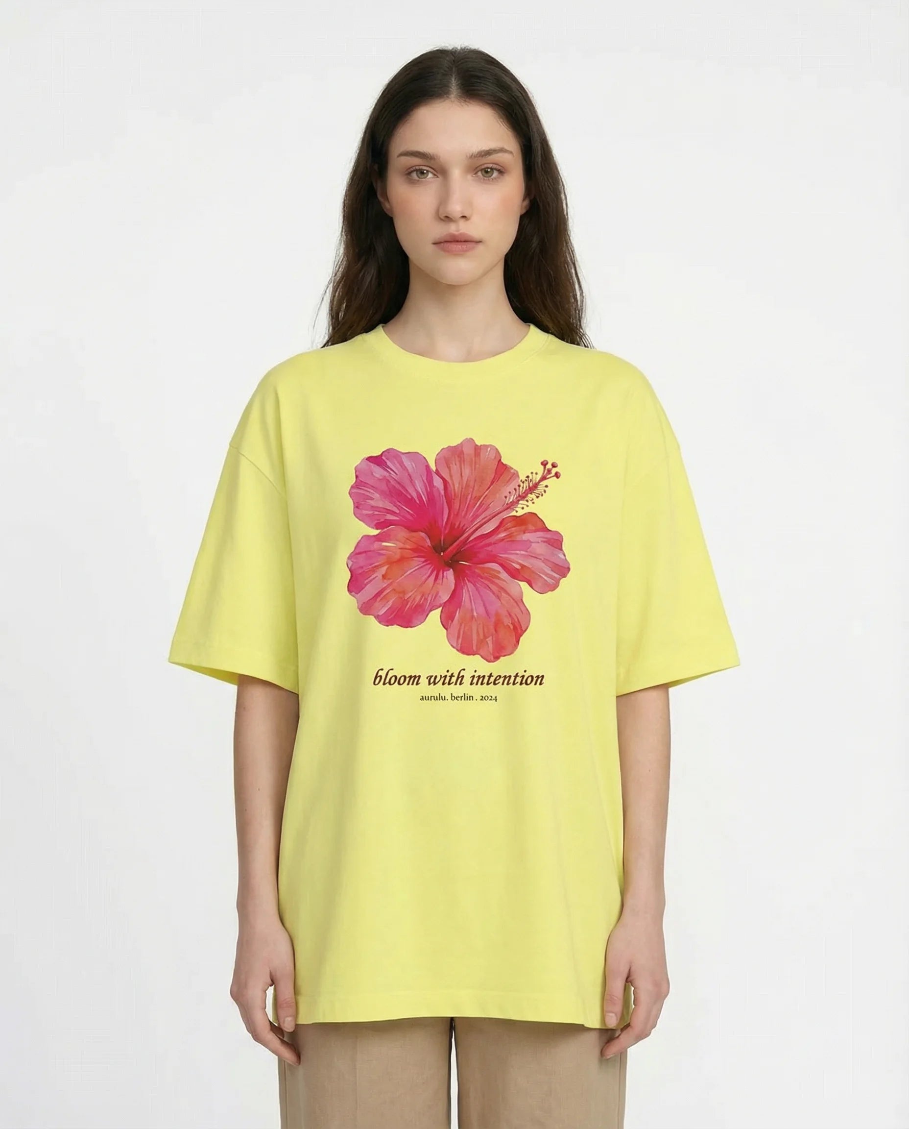 Aurulu Bloom With Intention women's oversized print tee featuring a vibrant, artistic floral design on soft fabric.