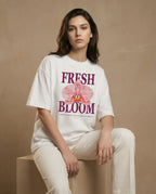 Fresh Bloom women's oversized tee with floral print, soft fabric and relaxed fit by aurulu, shown on a model.