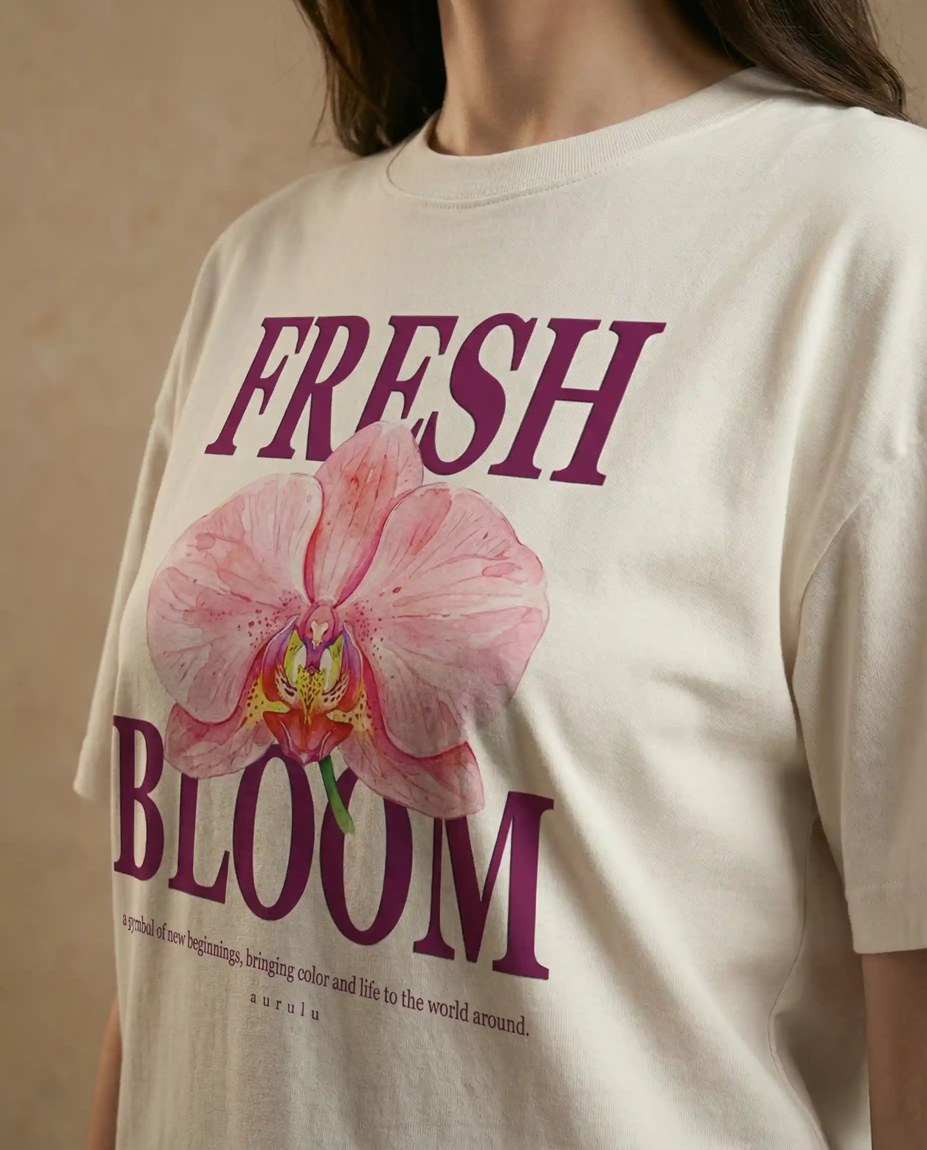 Fresh Bloom women's oversized tee with colorful floral print by aurulu, casual fit, displayed on a white background.