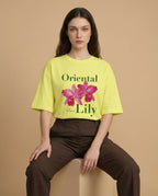 Oversized women's tee by aurulu featuring a vibrant oriental lily print on soft, comfortable fabric.