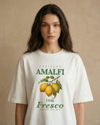 Amalfi Fresco women's oversized tee by Aurulu featuring a vibrant print inspired by Positano and Amalfi coast scenery.