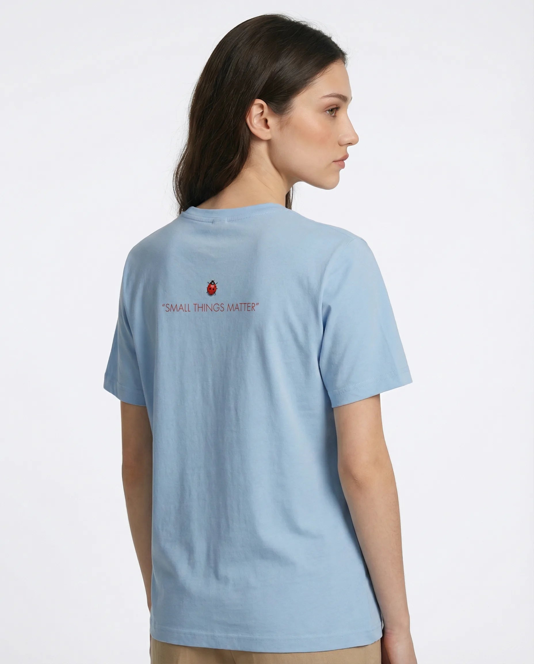 Small Things Matter women's tee by aurulu featuring a printed design on soft fabric, displayed flat with a close-up view.