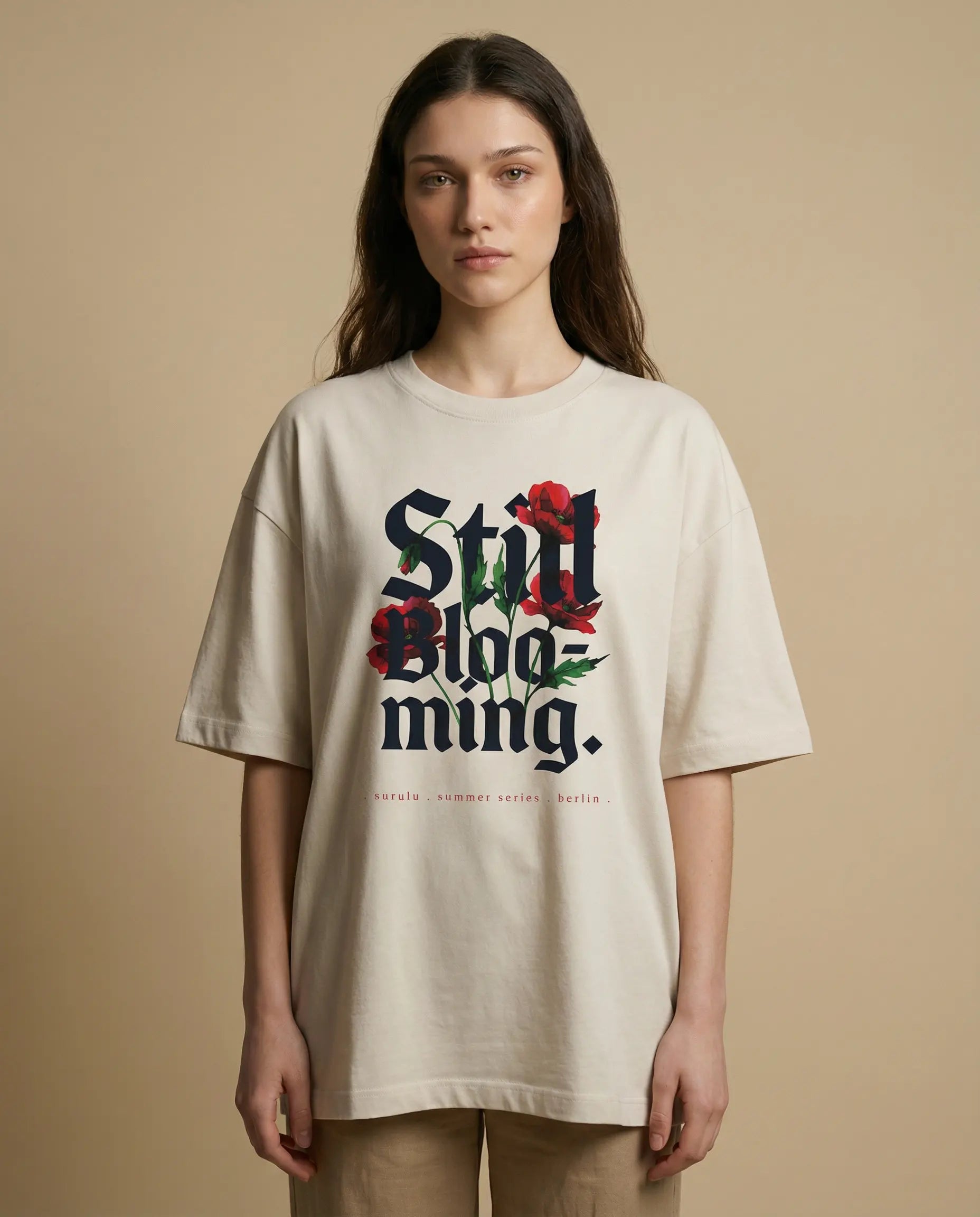Still Blooming women's oversized tee with floral print by aurulu, featuring a relaxed fit and vibrant design.