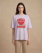 Sweet Summer women's oversized tee with colorful print design, made by aurulu, laid flat showing the relaxed fit and vibrant graphics.