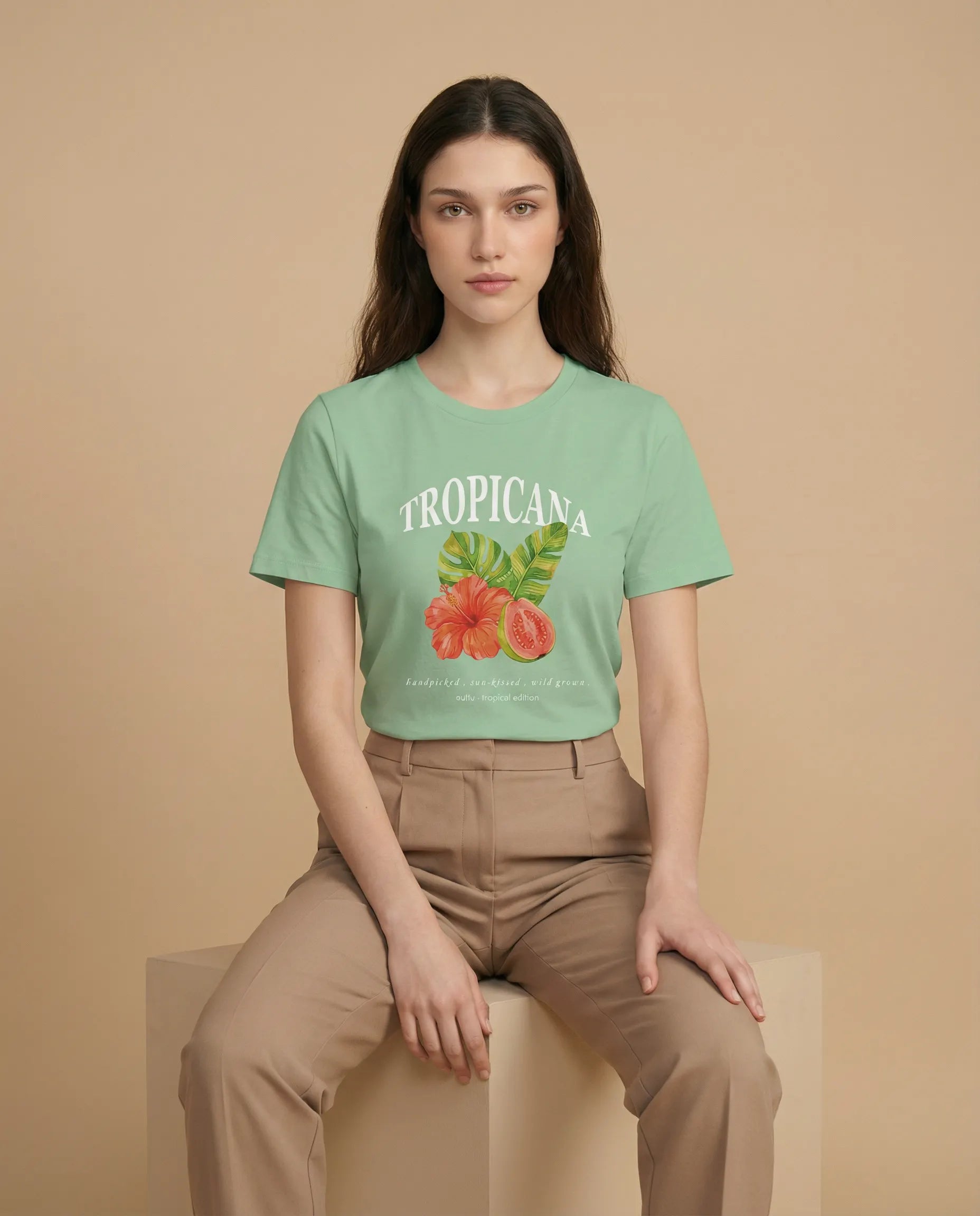 Tropicana Women's Tee by aurulu featuring a vibrant print design on soft fabric, shown laid flat with a close-up of the print.