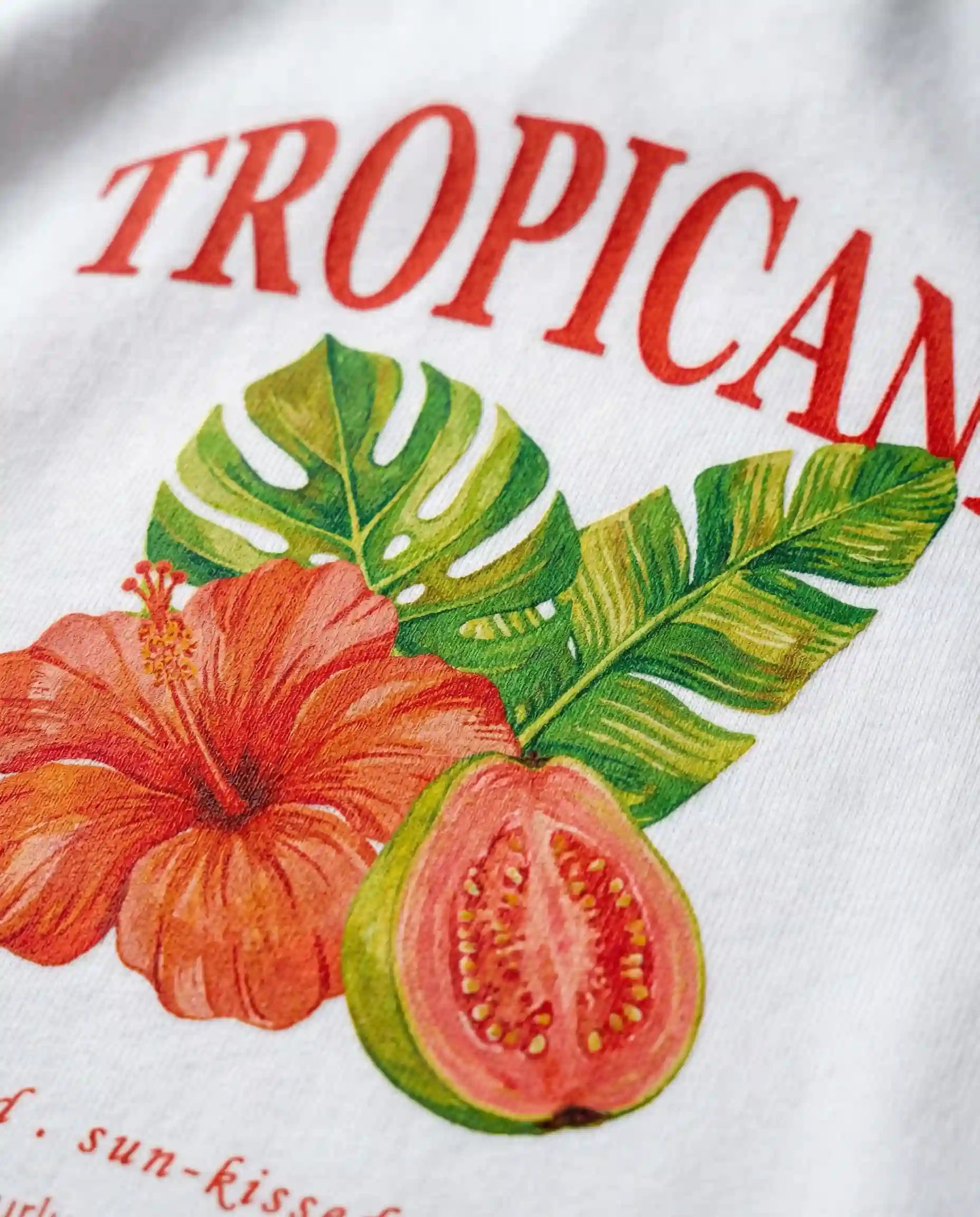 Tropicana Women's Tee by Aurulu featuring colorful tropical print on soft fabric, casual short-sleeve style.