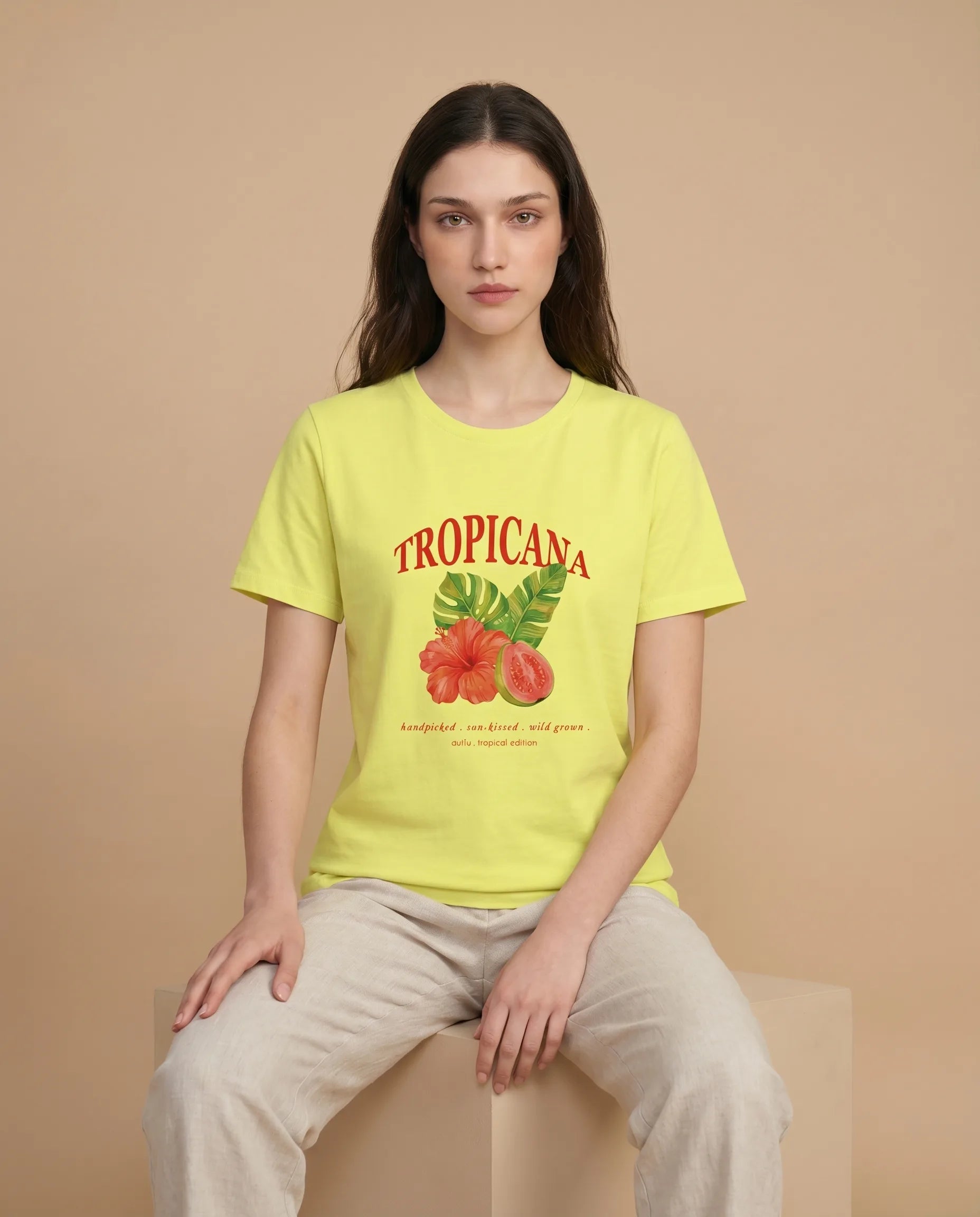 Tropicana Women's Print Tee by aurulu, featuring a vibrant tropical fruit design on soft fabric.