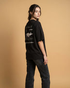 Unisex oversized High Altitude Club organic cotton T-shirt with printed design by aurulu, shown in navy blue color.